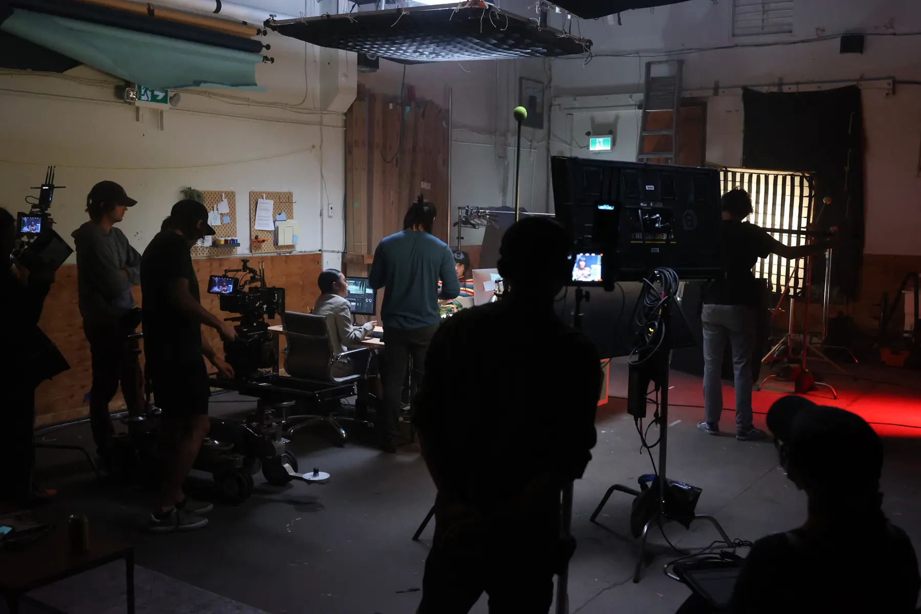 Camera crew filming on a studio set